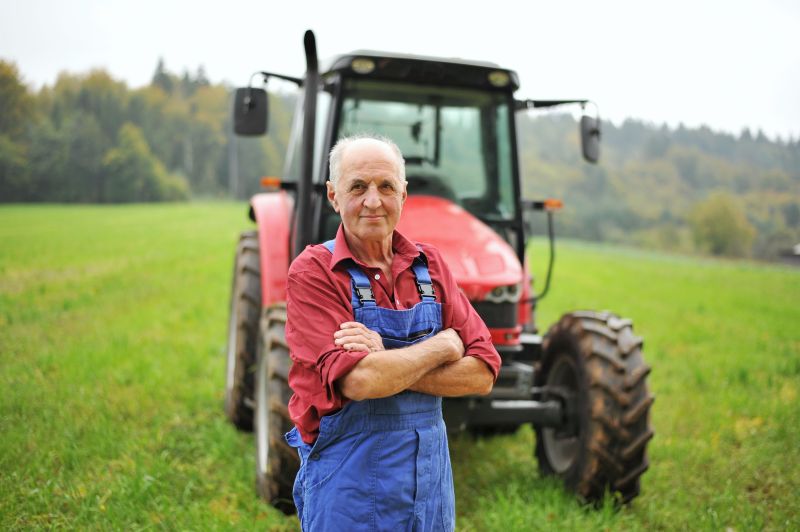 Farmer stood in front of tractor